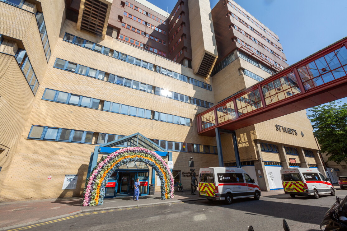 Front of St Mary's hospital with flowers around the door 