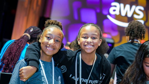 AWS Girls in Tech event with young girls smiling