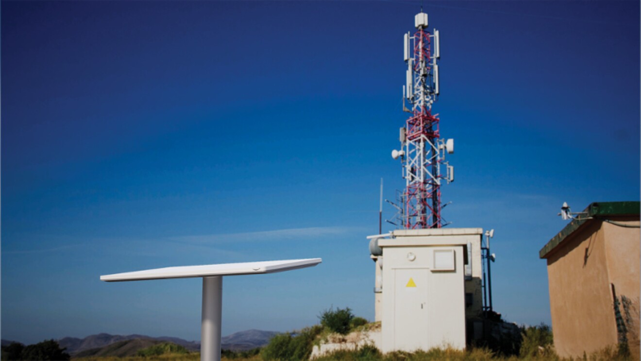 An image of Project Kuiper’s enterprise-grade customer terminal antennas next to an antenna.