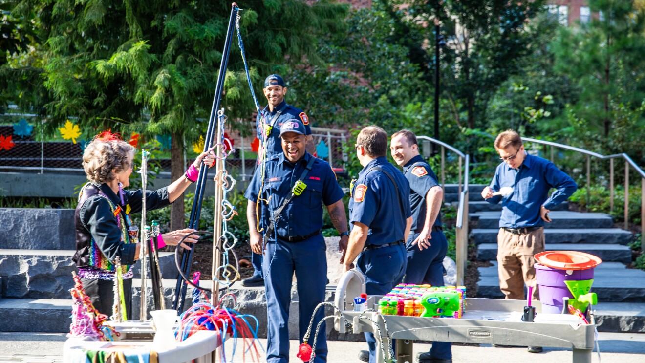 Amazon's HQ2 Community Day: people laughing and smiling at a community event