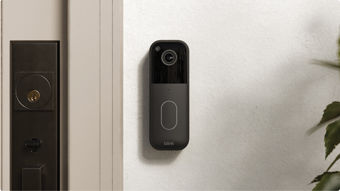 Blink video doorbell mounted beside deadbolt and keyhole