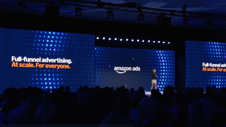 Amazon Ads presentation on stage featuring the tagline 'Full-funnel advertising. At scale. For everyone.'