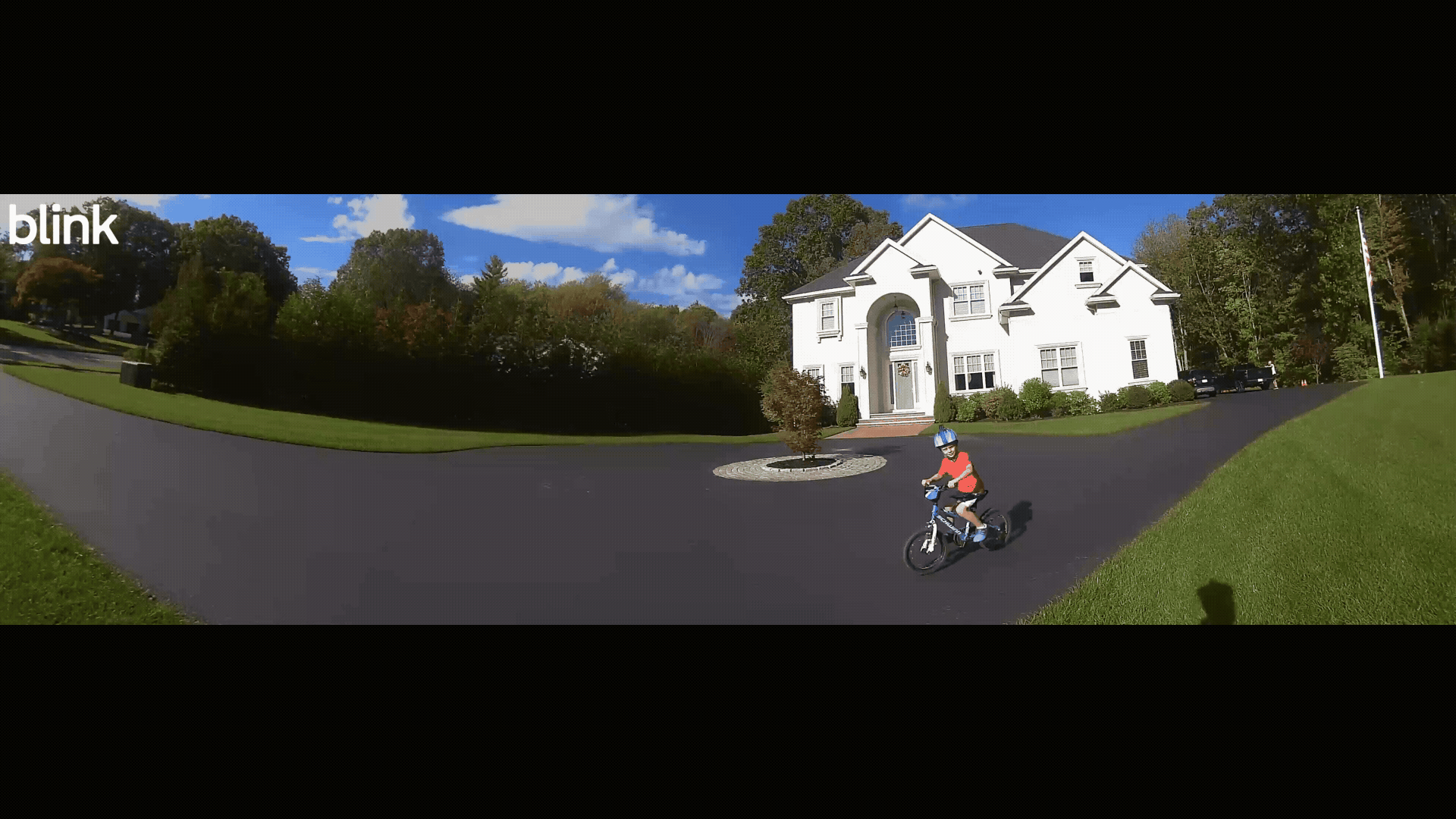 Blink panoramic view displaying a child riding a bicycle