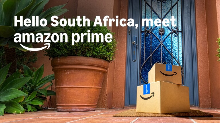 Amazon Prime boxes delivered to a South African doorstep with decorative blue door and terracotta plant pot