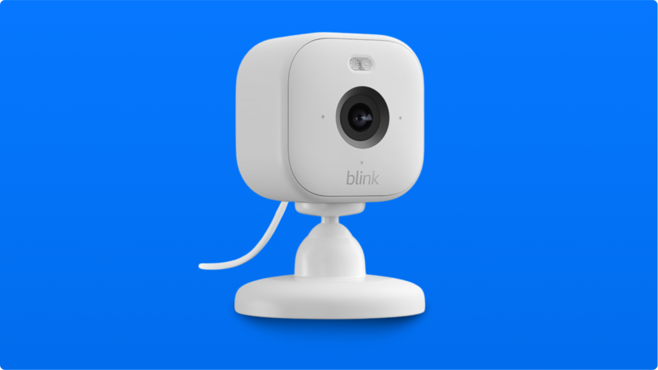 White Blink security camera on stand against blue background