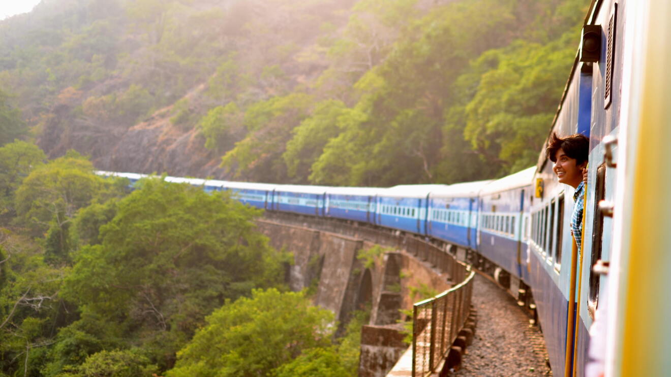 Train passing by a scenic landscape