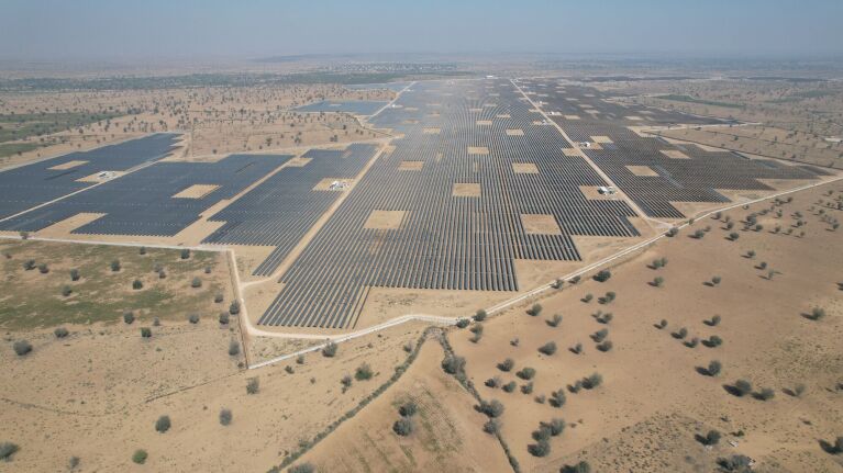 Amazon renewable: India massive solar farm in arid desert landscape