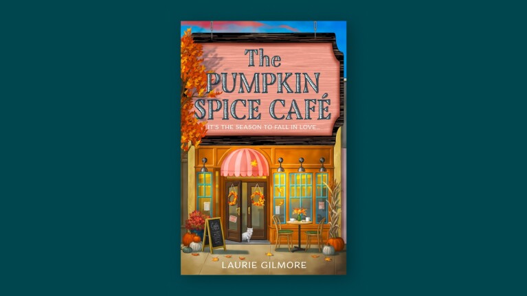 Illustrated café storefront with 'The Pumpkin Spice Café' sign and fall decorations