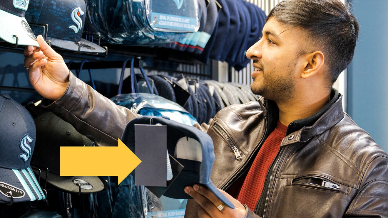 A photo of a customer shopping in a store at Climate Pledge Arena that uses Just Walk Out technology.