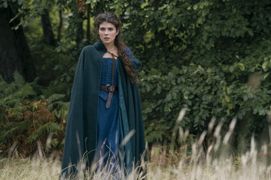 A photo of My Lady Jane cast member standing in a field