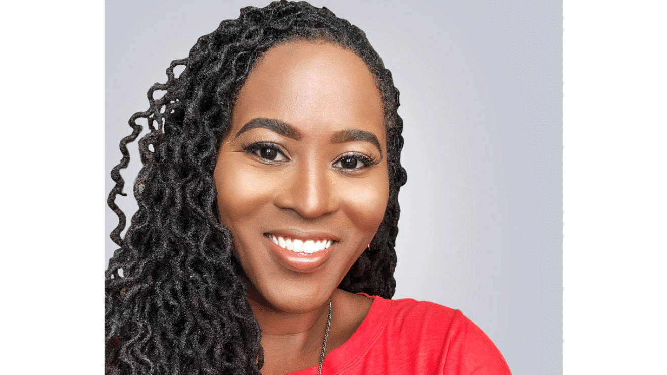 Headshot of Tiffany Bowden. Gray background is behind her.