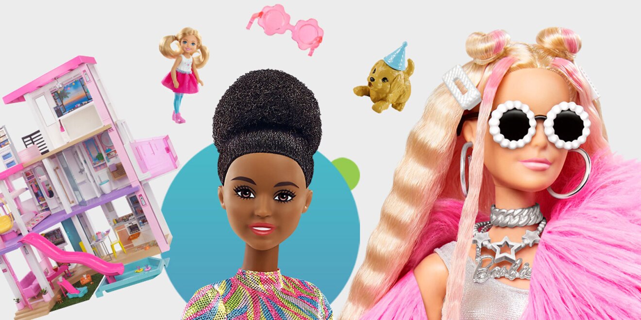 A close-up image of two barbie dolls, next to a scaled down version of their barbie dream house and accessories like sunglasses and a pet dog