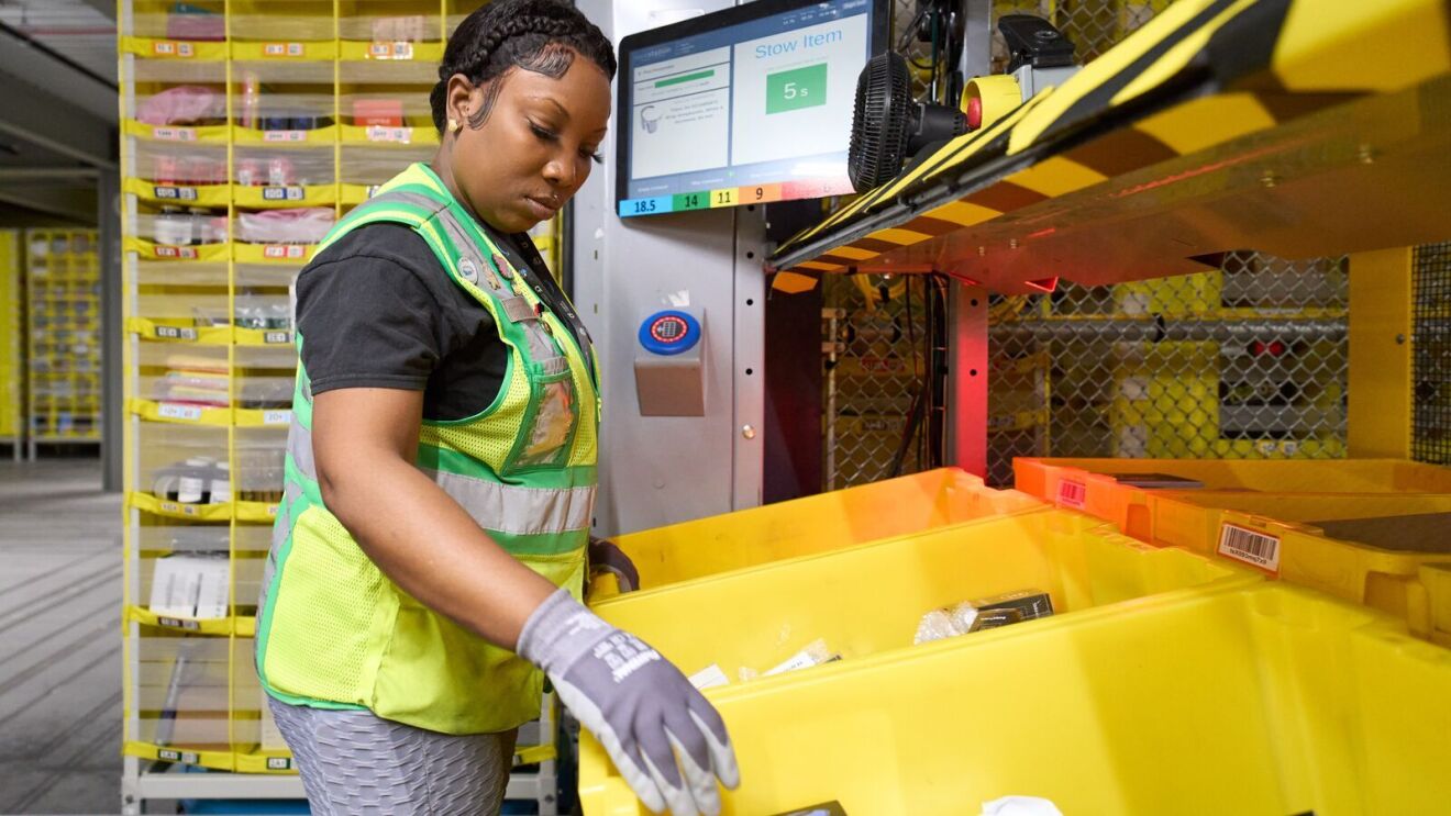 Image of an employee working in an Amazon fulfillment center.