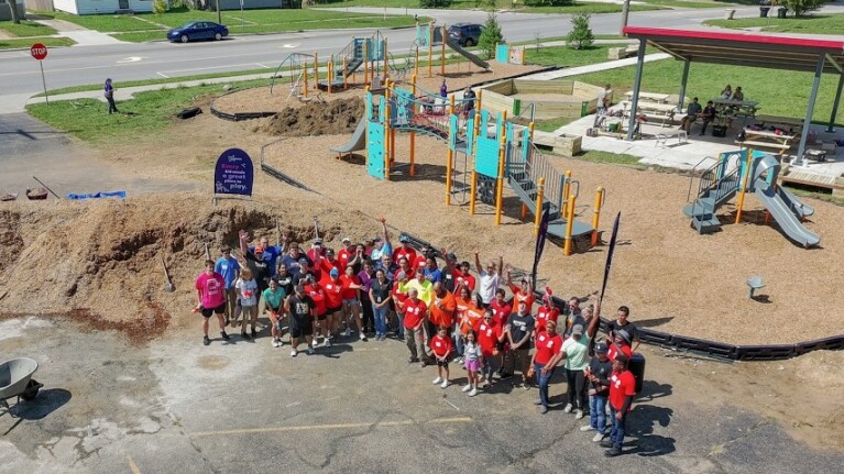 Group of individuals in front of a playground in Indiana