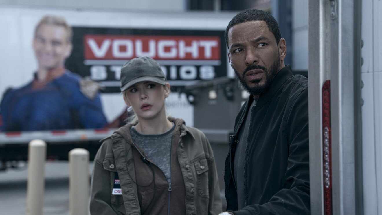  The Boys: Two people looking concerned outside Vought Studios building