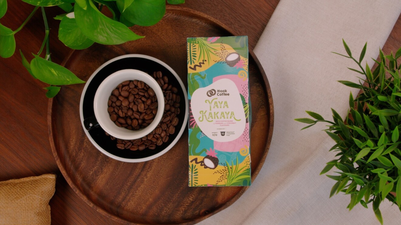 A box of coffee from Hook Coffee placed next to a cup