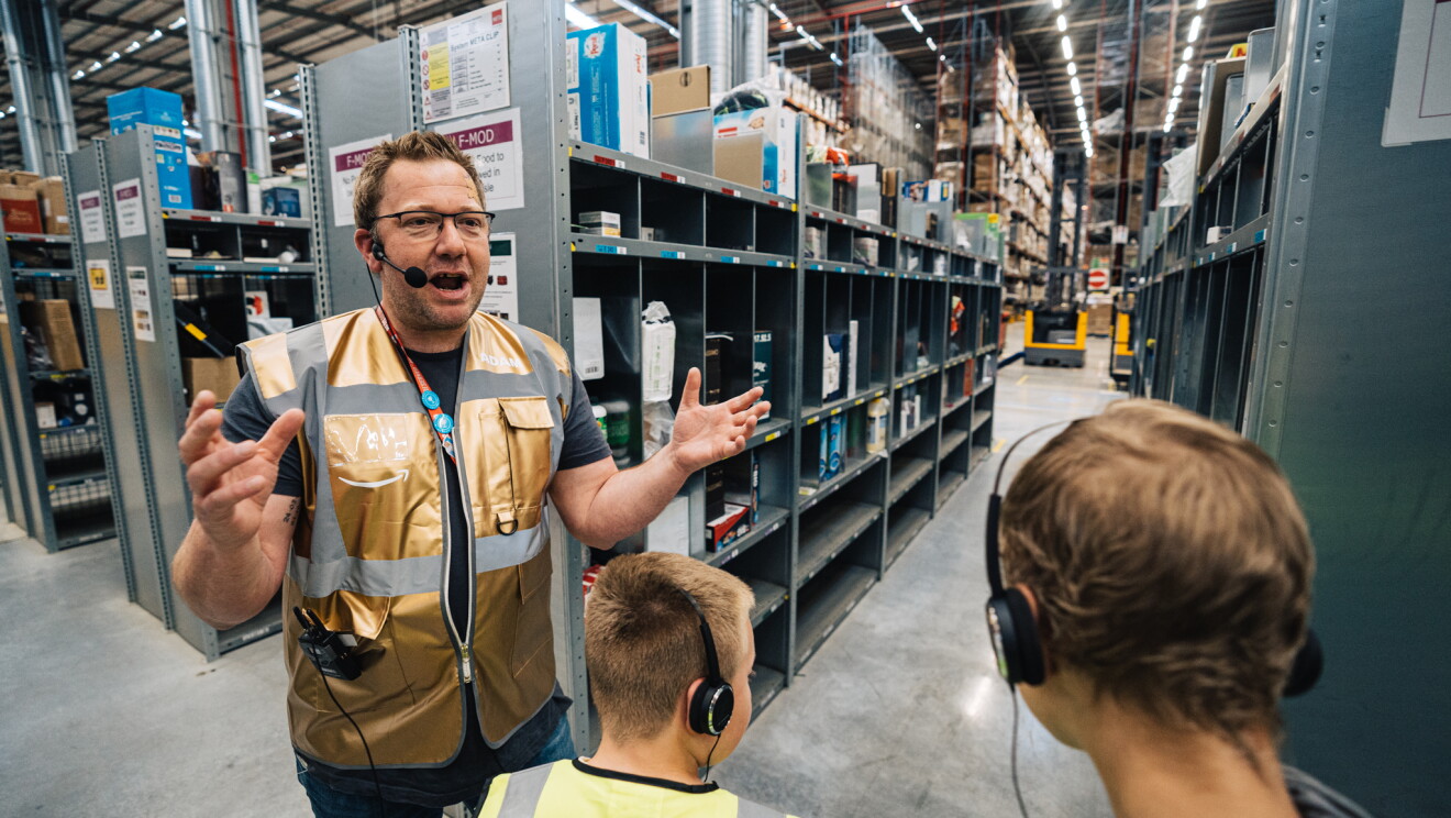 Amazon staff member with children at Amazon Goes Gold event 