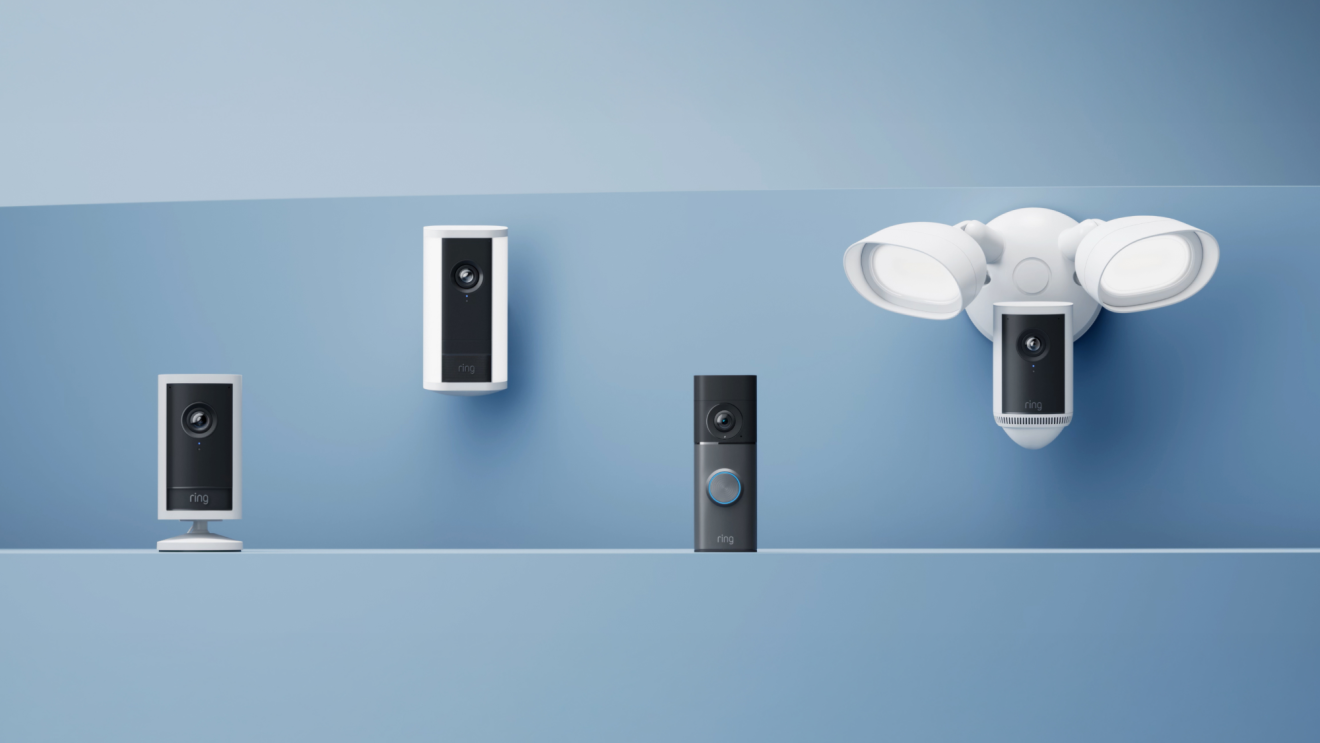 Four Ring security cameras displayed on blue background