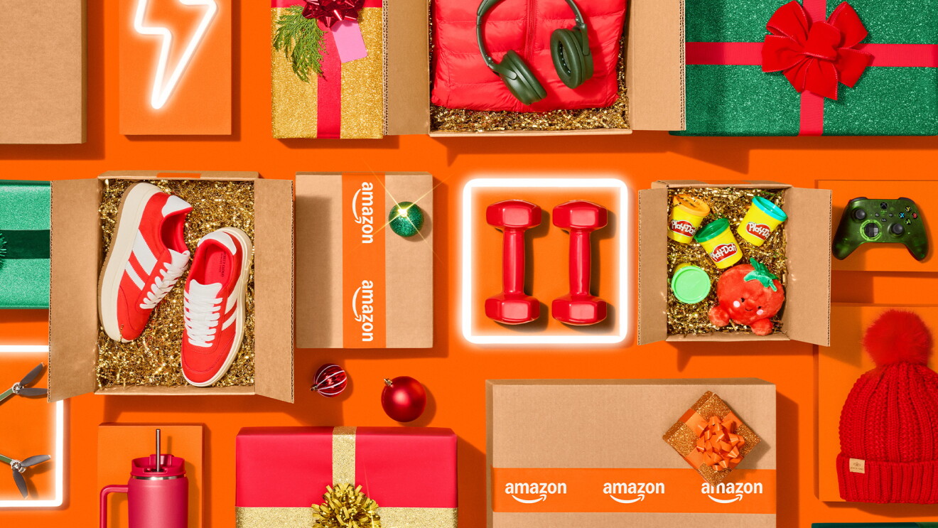 Festive product display with Amazon boxes, sneakers, headphones, and wrapped presents
