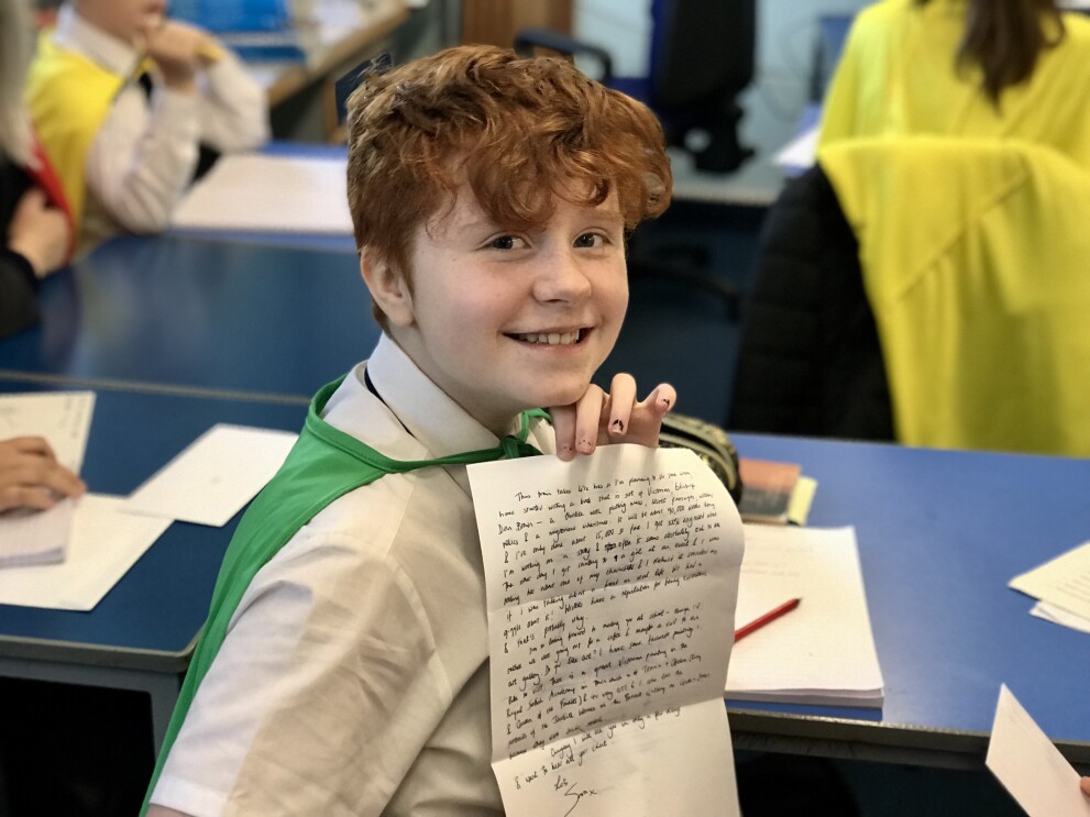 8. Child with Writing .jpg Literacy