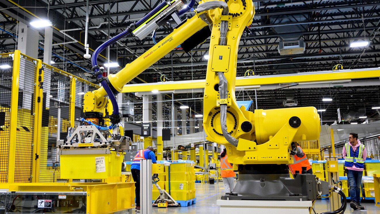 A photo of a robot in an Amazon facility center