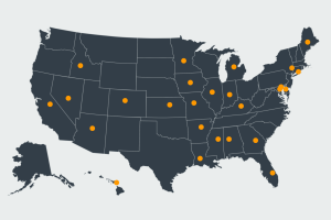 An image of a blue map of the US with orange dots pinpointing certain areas.