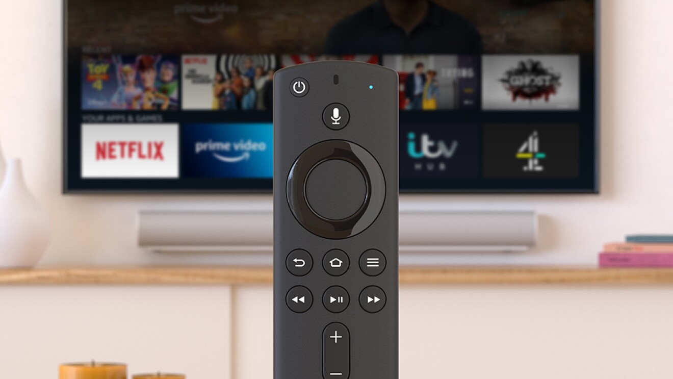 Fire TV remote in front of a television.