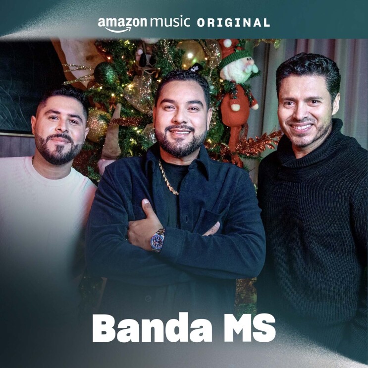 The album cover for the Bana MS song. There are three men smiling for a photo in front of a holiday tree.