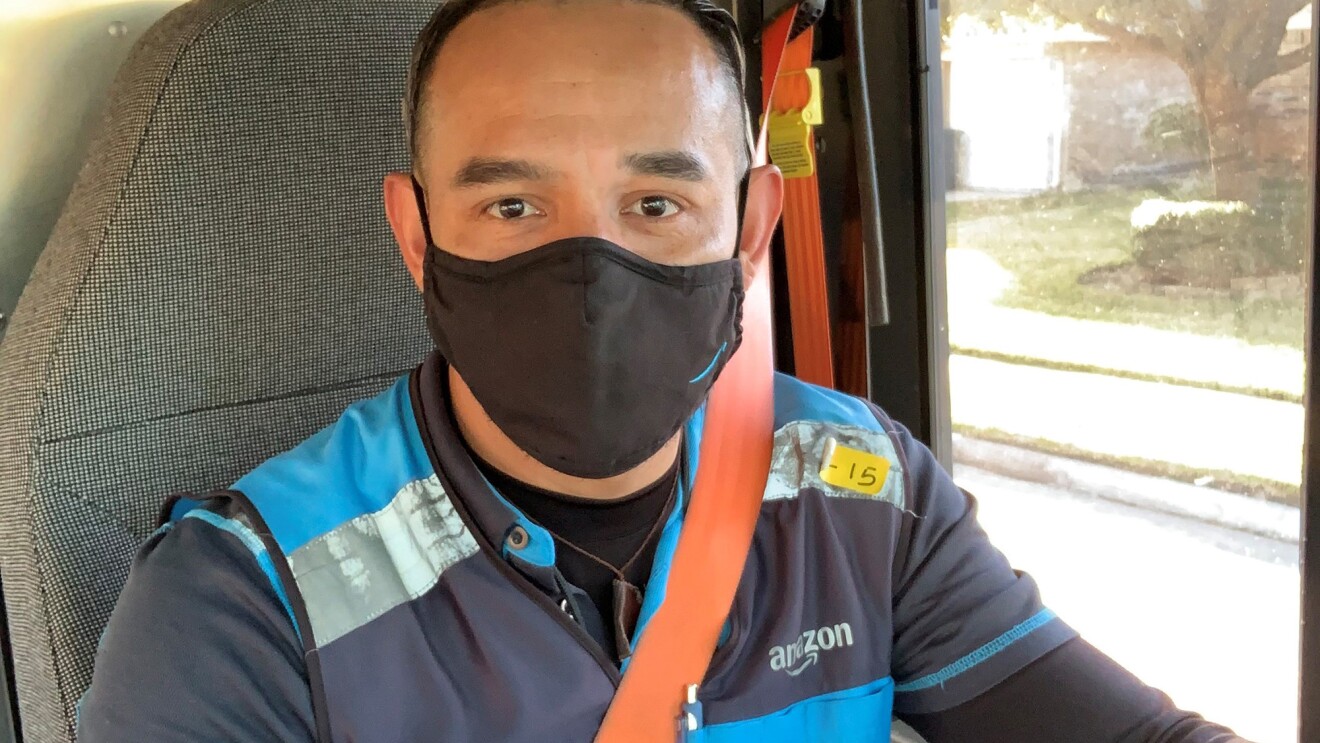 Amazon Delivery Service Provider (DSP) in their work vehicle, wearing an Amazon vest