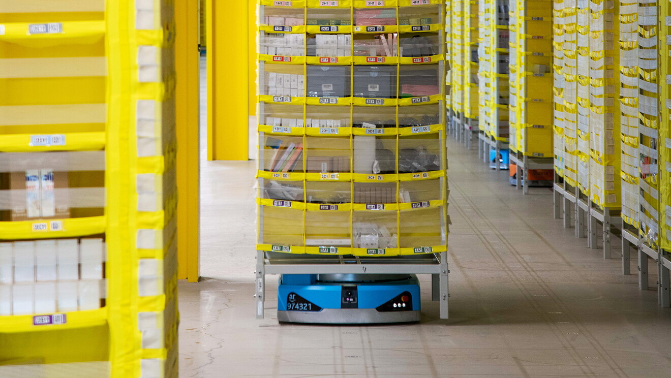 Amazon Robot holding a shelf with products at a warehouse