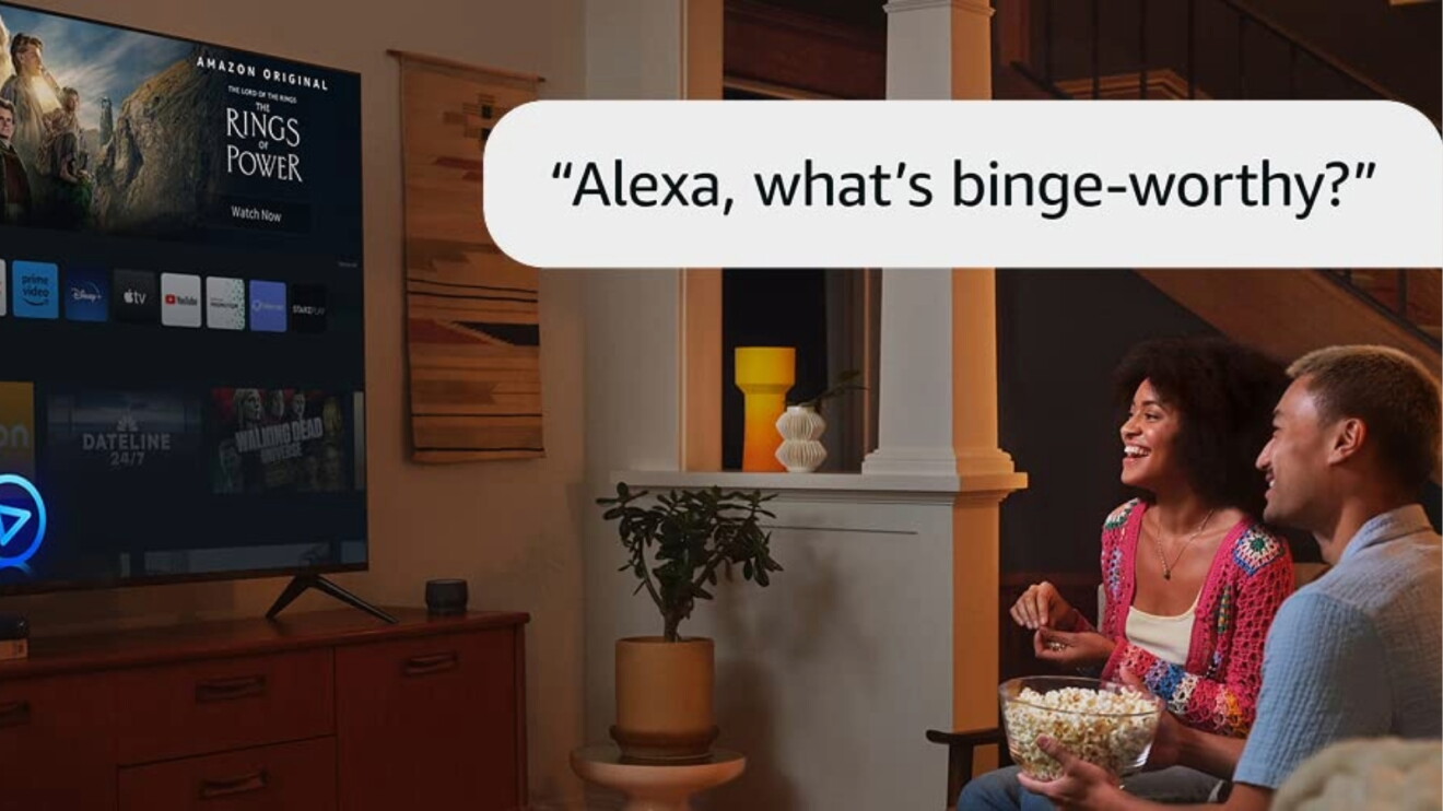 Couple enjoying popcorn, asking Alexa for binge-worthy shows on smart TV