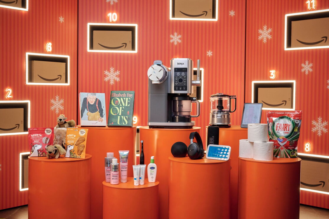 Black Friday Deal Products in front of a giant advent calendar with Amazon boxes