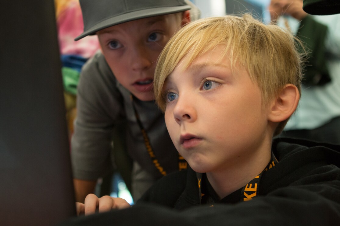 Students participate in a Camp Amazon event at a fulfillment center in Washington