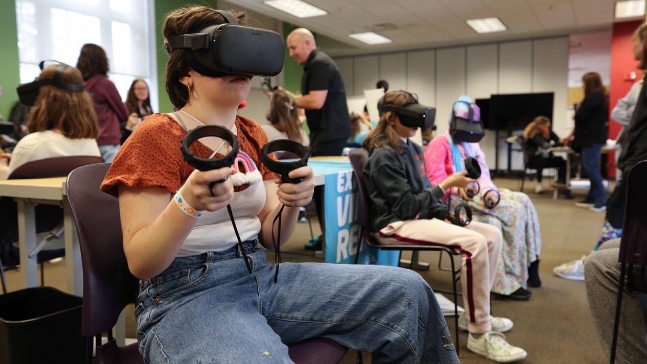 A photo of students using virtual reality tools at an AWS Think Big Space in Ohio.