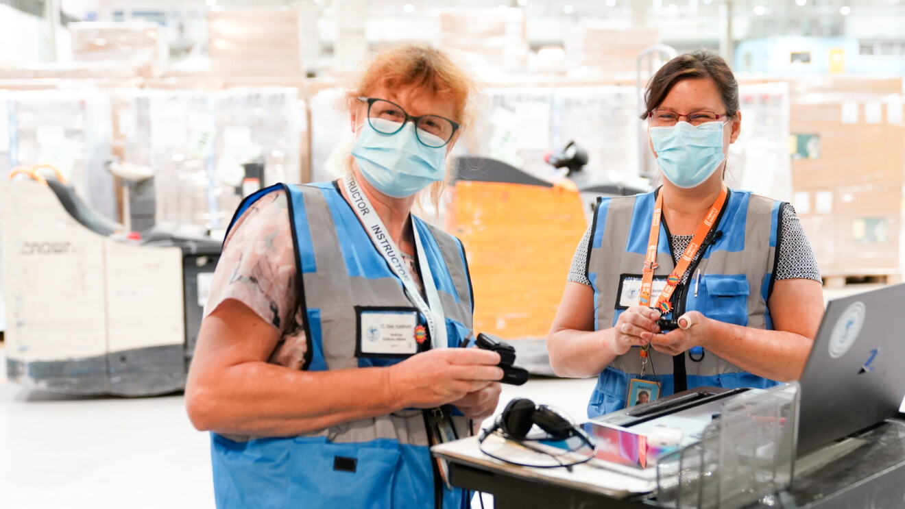 Amazon employees in an FC center