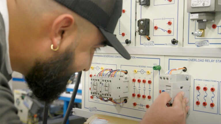 An image of an engineering operations technician working at Amazon.