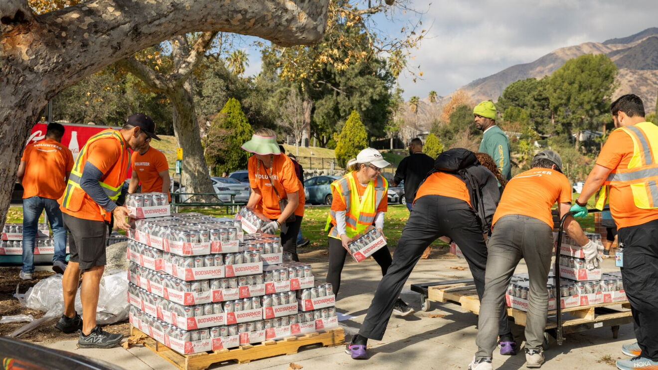 Wildfire disaster relief hub: Disaster relief effort with workers distributing bottled water
