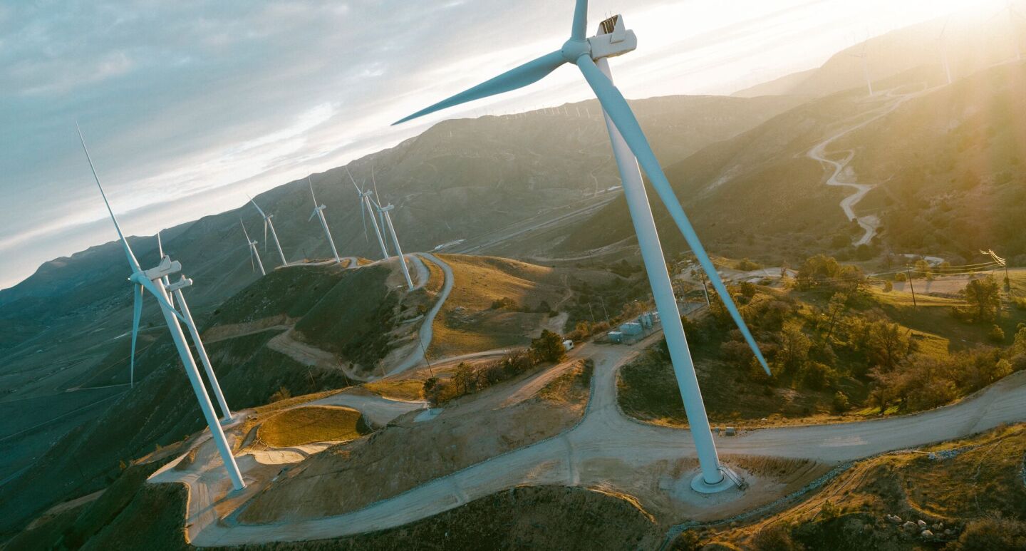 Renewable energy landscape with wind turbines and river