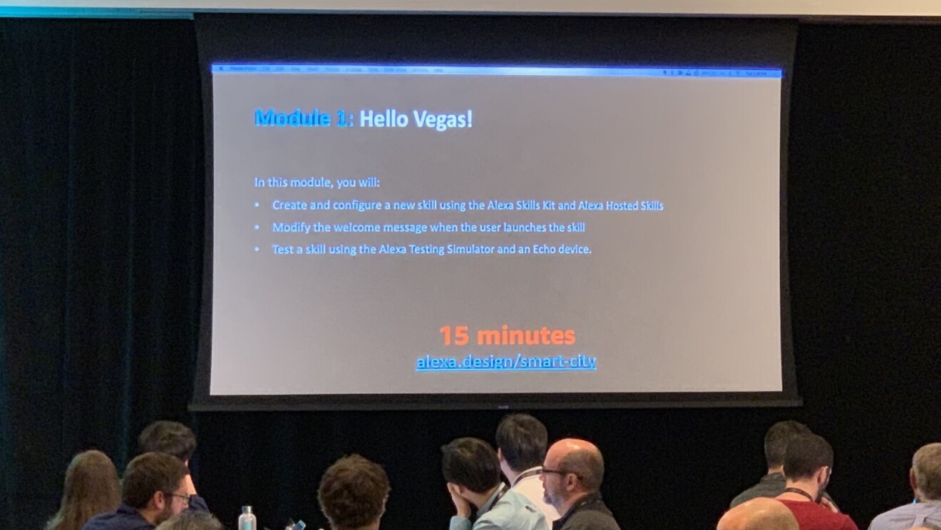 People at a conference room looking at a presentation