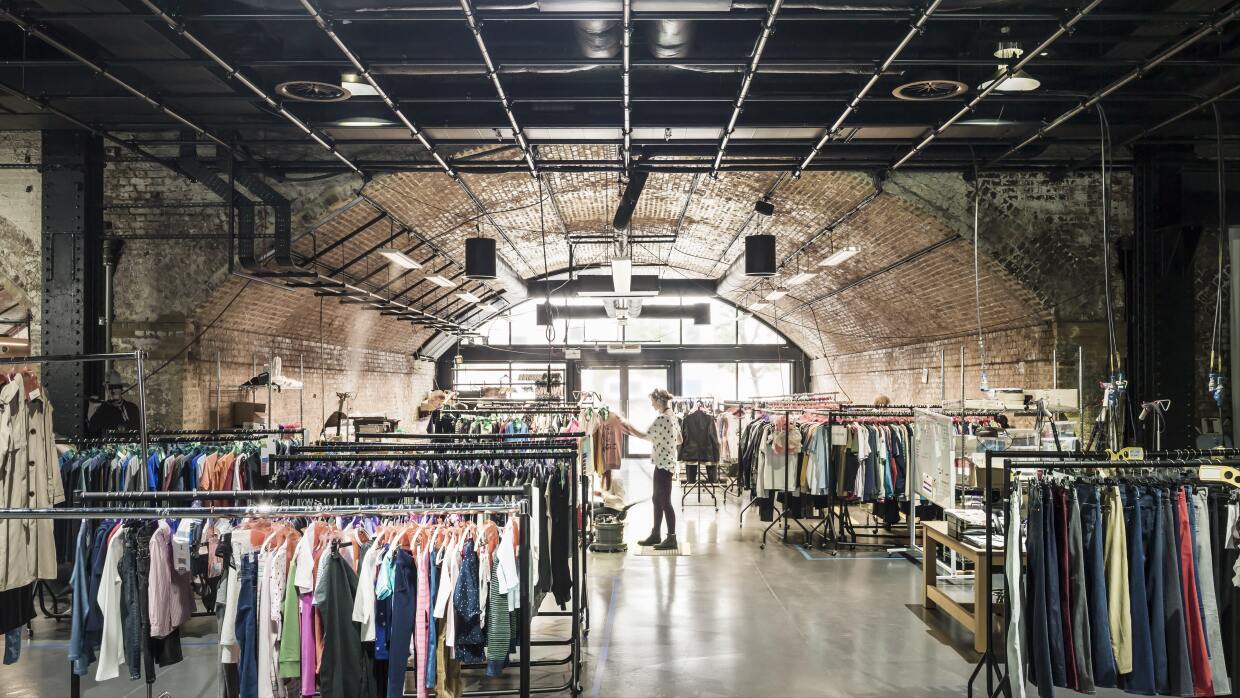 Racks of clothes and architecture inseid Amazon's Fashion Studio in Hoxton