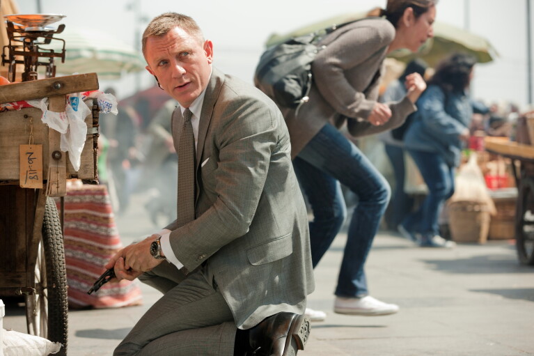 A tense moment captured in a bustling marketplace, taken from Skyfall