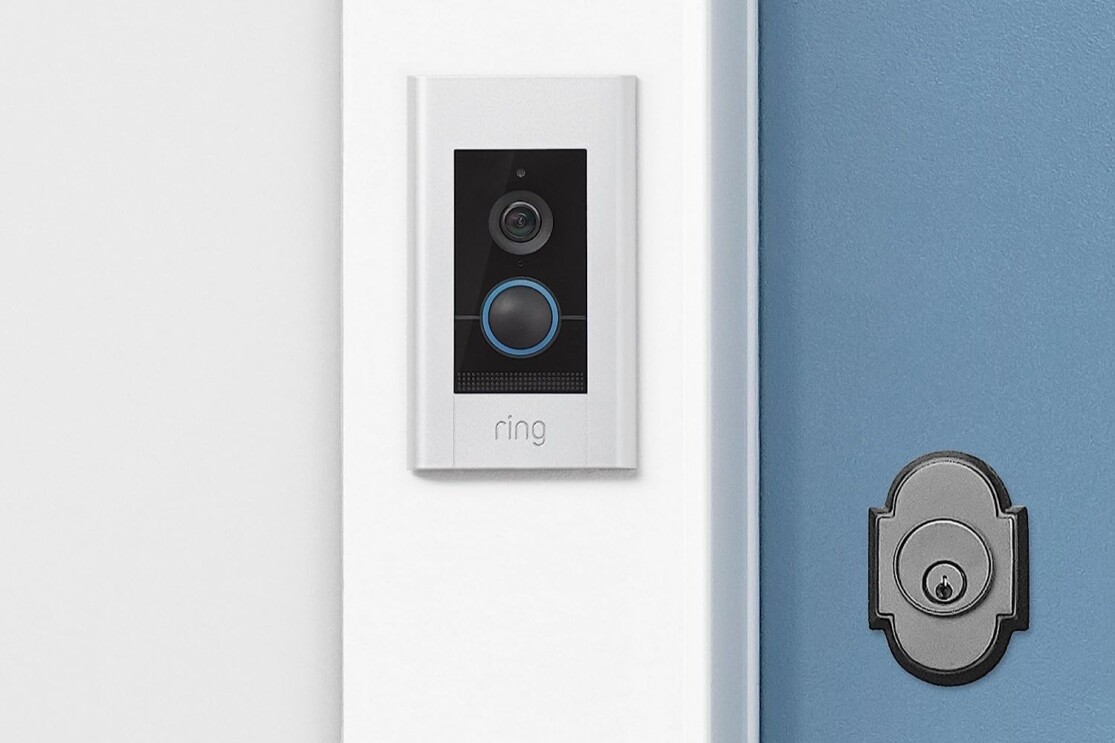 Ring Video Doorbell Elite next to a blue door