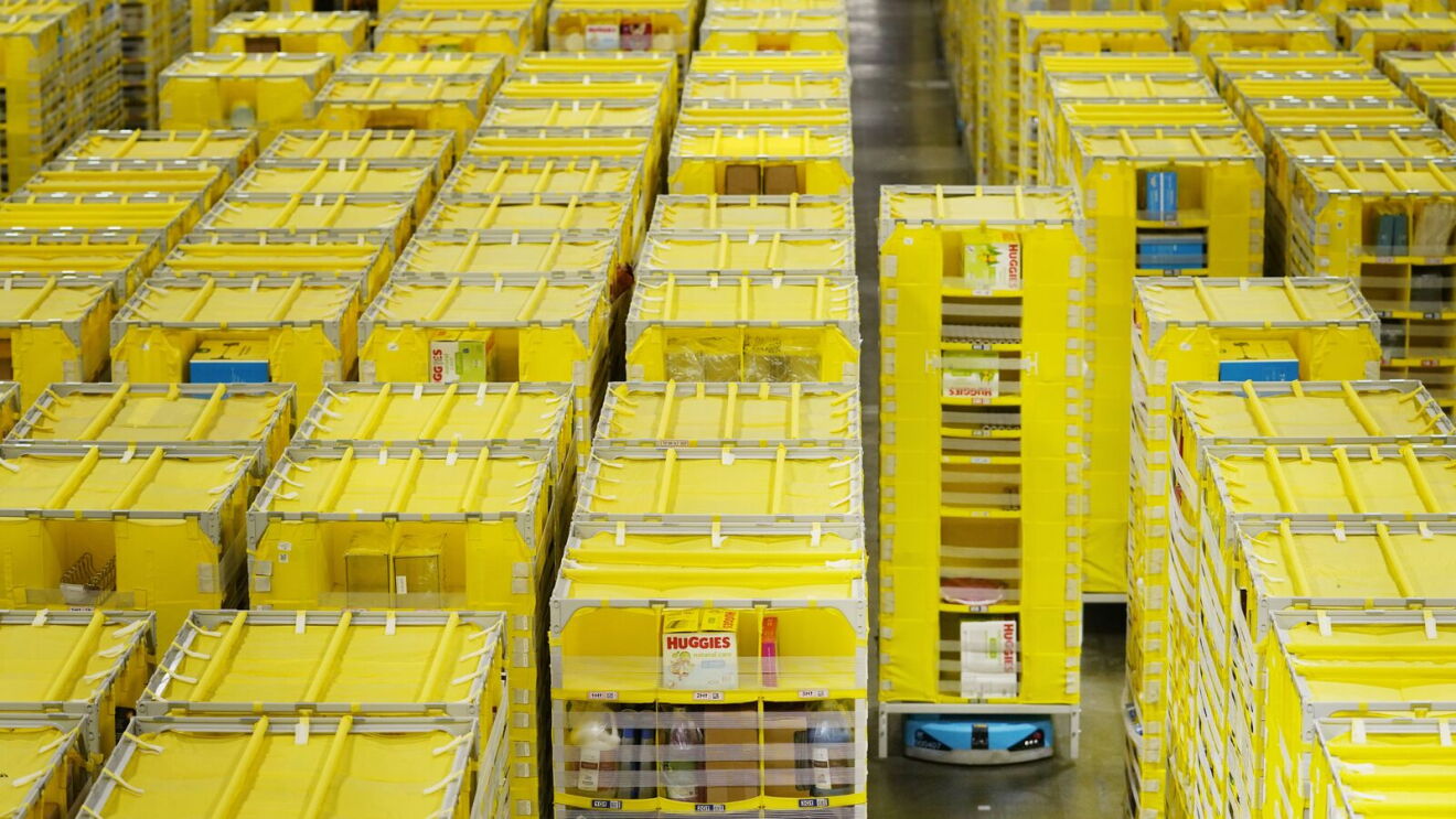 A robot moving stacks of packages at a fulfillment center