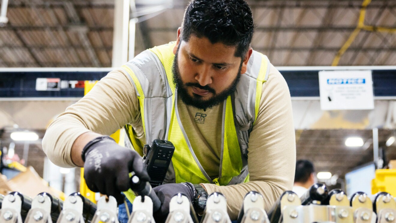 An Amazon employee works in a fulfillment center.