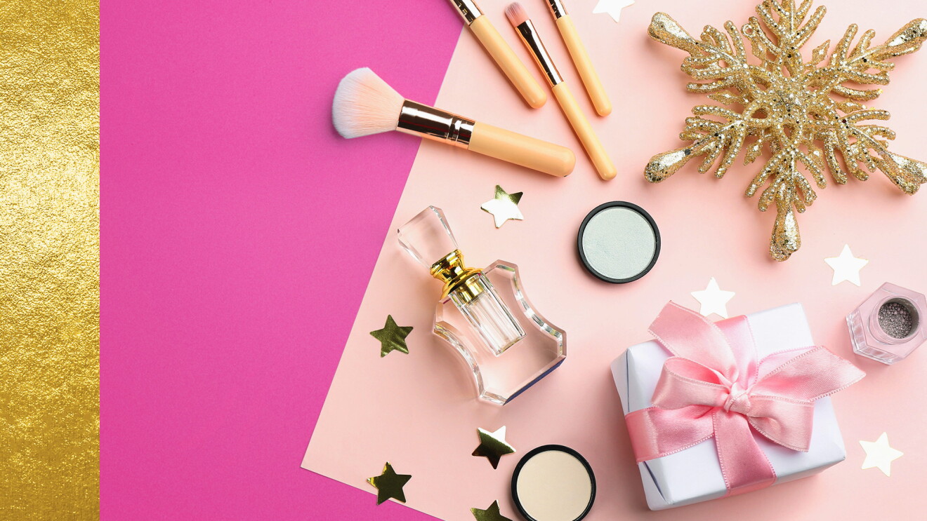 Beauty products on pink and gold background 