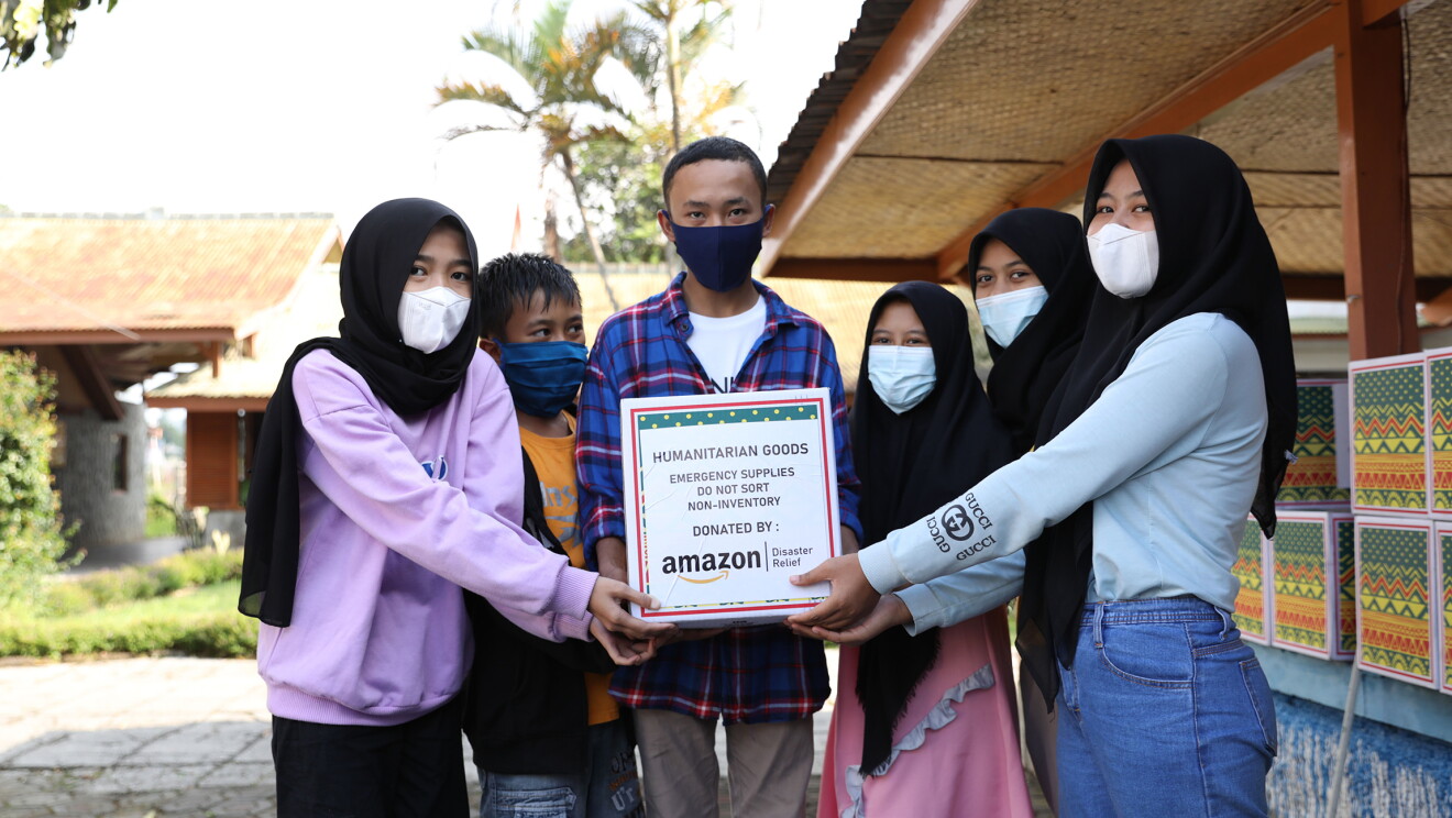 Families in Cipanas, Indonesia receiving grocery kits