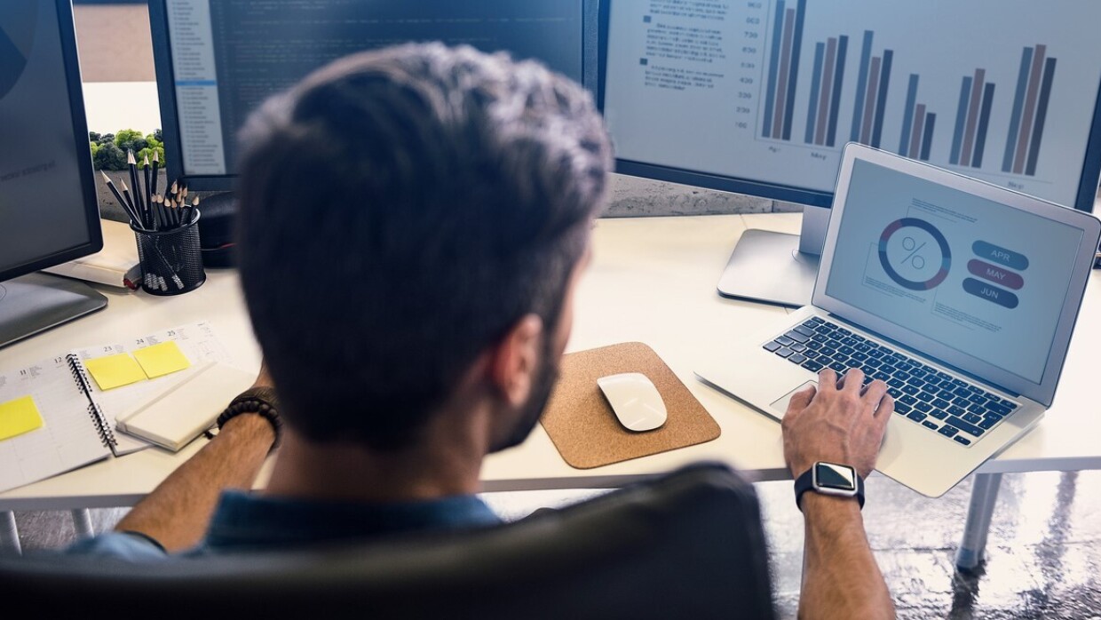 Male doing estimation on laptop screen