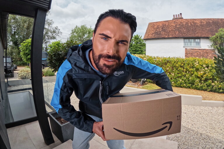 Rylan Clark peers into Ring camera to deliver a package for Prime Day 2026