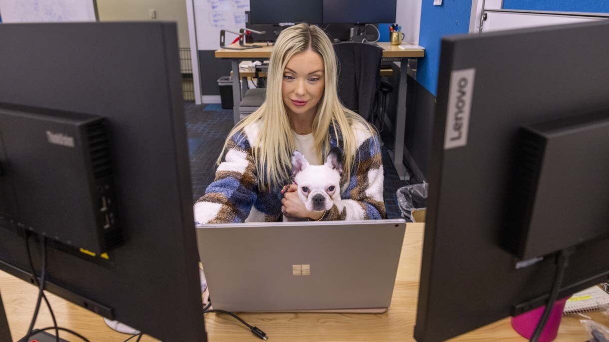 An image of dogs in the office at Amazon's Seattle headquarters with employees.