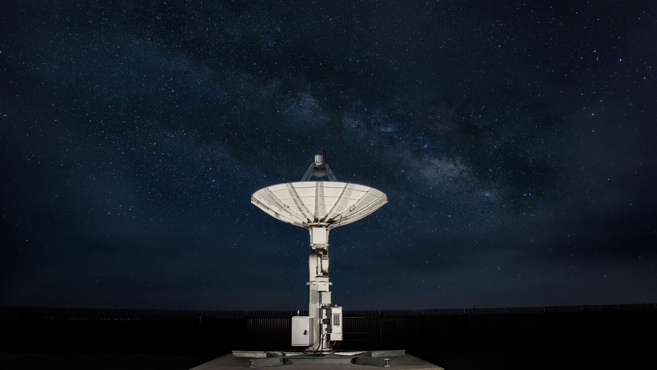 Amazon Web Services satellite shown in natural, outdoor environment.